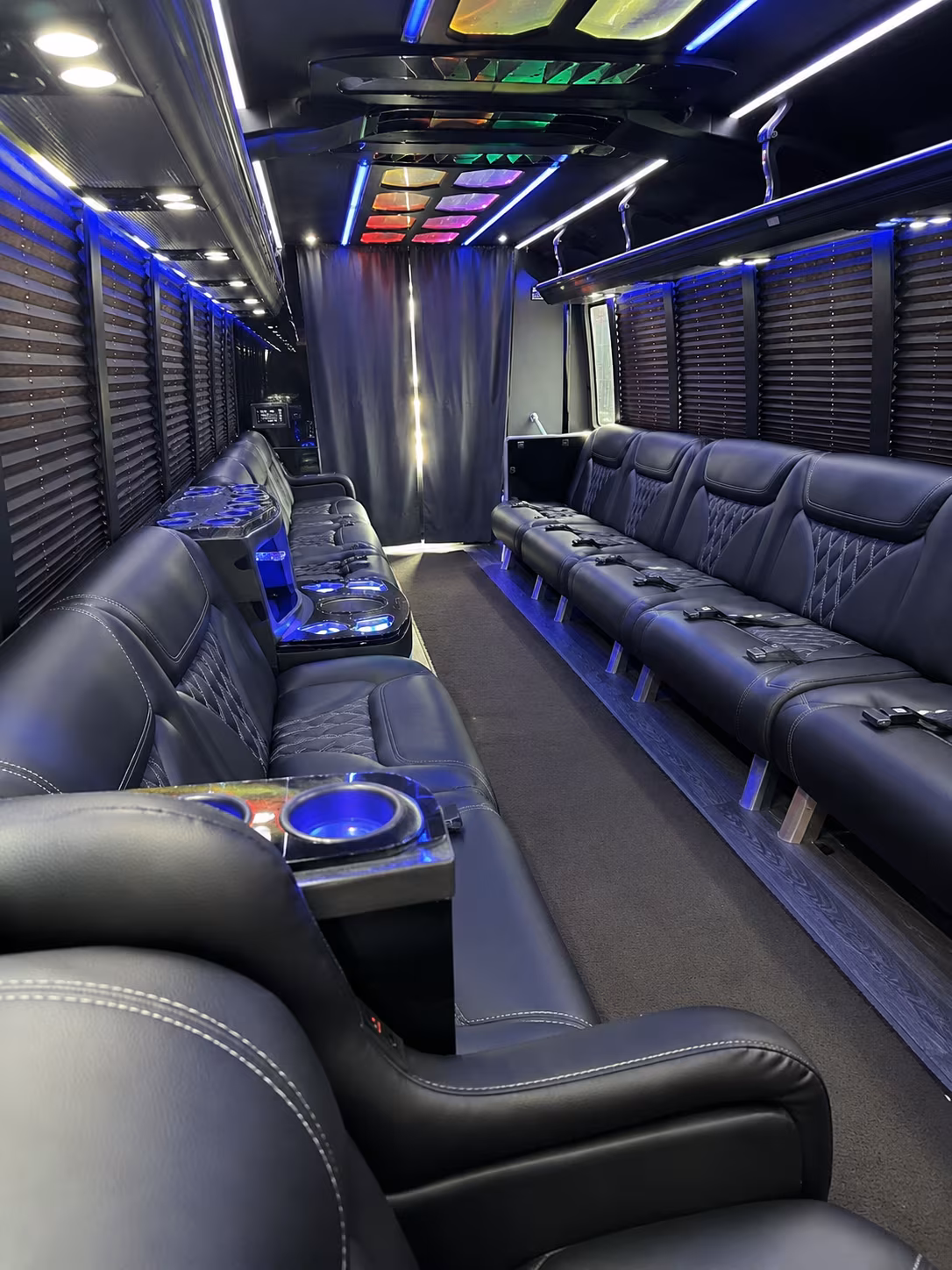 Friends laughing during a party bus celebration in Mesa