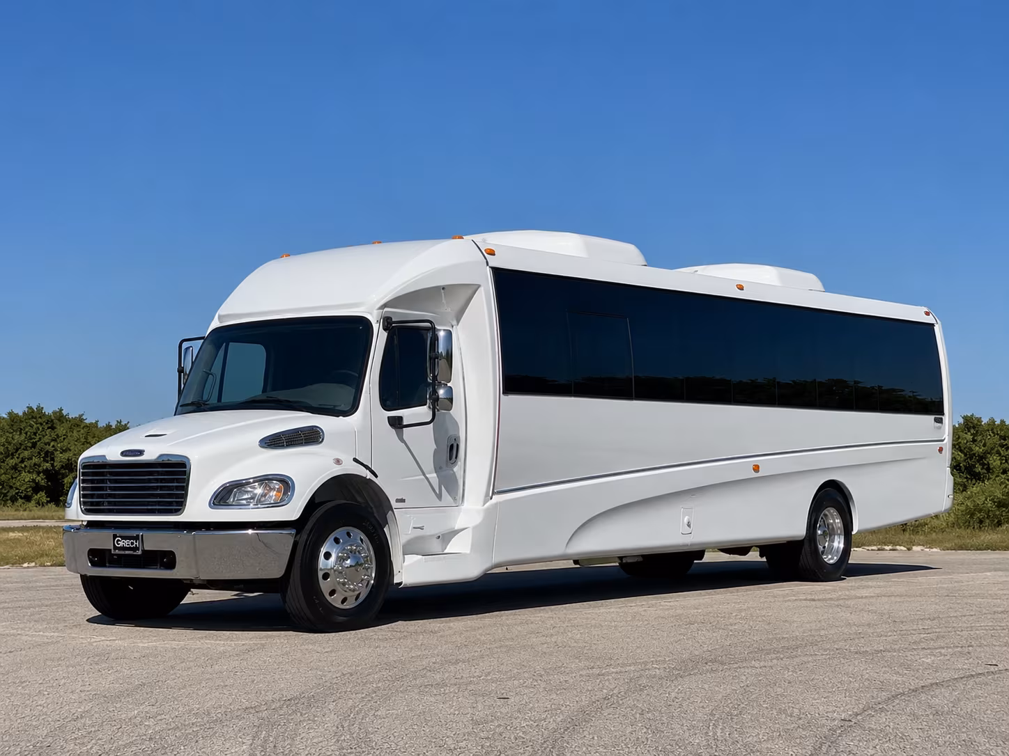 Group beside a Mercedes Sprinter limo in Mesa