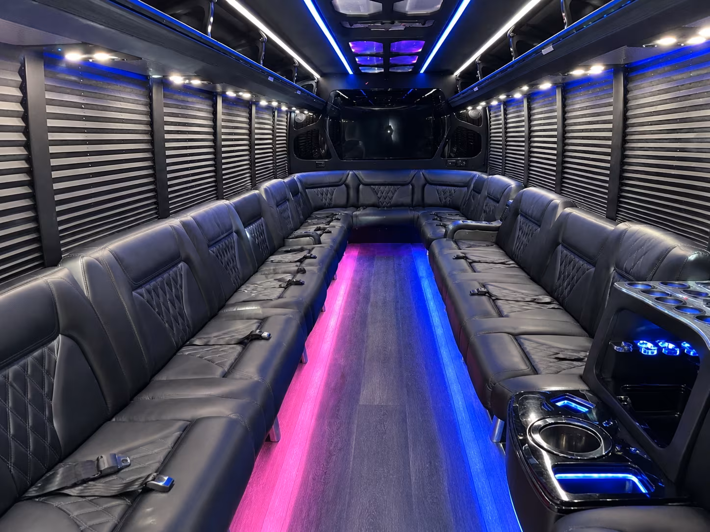 Wedding guests seated inside a party bus serving Mesa